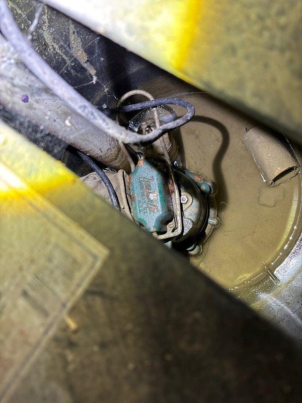 Responded to emergency service call for sump pump failure in residential basement. Upon arrival, conducted thorough inspection of the existing sump pump system and surrounding discharge piping. Diagnosed complete pump motor failure on unit serving a 3-year-old home where malfunction began approximately 24 hours prior to service call.

Removed failed sump pump assembly from basin and verified basin condition and float switch operation. Identified significant corrosion and oxidation on pump housing and mechanical components, indicating premature wear despite relatively new home age. Cleared debris and sediment accumulation from sump basin to ensure proper operation of replacement unit.

Installed new sump pump assembly with appropriate horsepower rating for residential application. Connected discharge piping to existing PVC plumbing infrastructure, ensuring proper vertical discharge configuration through basement floor. Verified all pipe connections were secure and leak-free. Routed elec