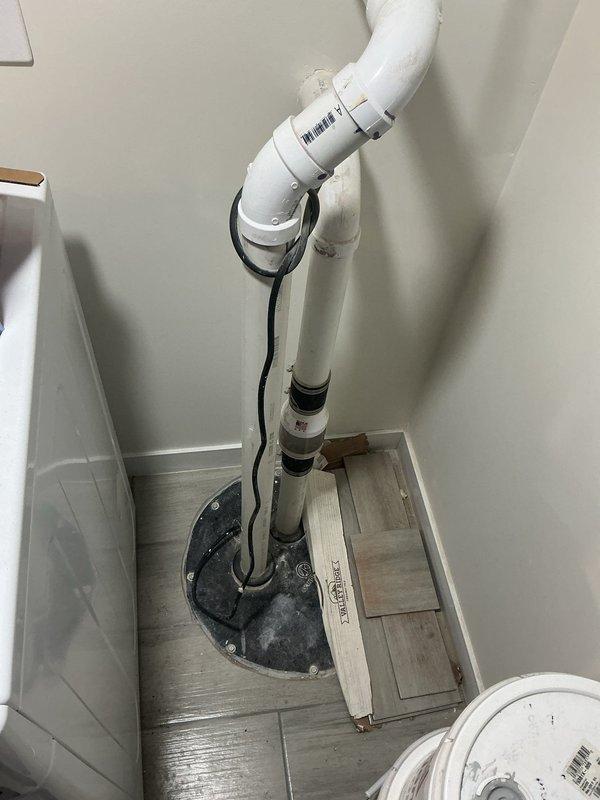 Responded to a sewer line backup affecting one location in an early 1900s home that had been recently renovated. Upon arrival, assessed the drainage system and identified the blockage point. Cleared the sewer line obstruction and restored proper flow to the affected area. Inspected the plumbing configuration, including the PVC drainage system with floor-mounted boot connection in the utility space. Verified all connections were secure and the system was functioning correctly. Tested the restored sewer line to ensure complete resolution of the backup issue.