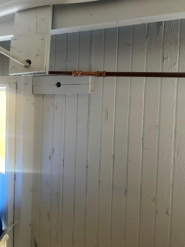 Responded to warranty service call for leaking outdoor spigot and bathroom faucet. Inspected disconnected exterior hose bib and assessed copper supply line connections behind interior wall access point. Identified leak source at coupling joint on copper piping. Provided estimate for bathroom faucet replacement as requested.