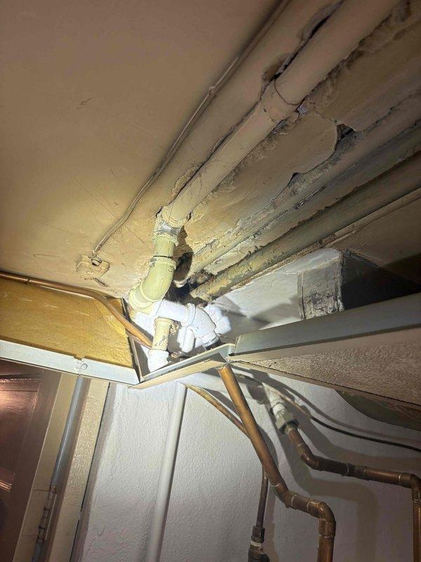 Responded to low water pressure complaint isolated to shower/tub area while rest of house maintained normal pressure. Investigated bathroom-specific plumbing infrastructure and accessed ceiling cavity to inspect supply lines serving the affected fixtures. Identified deteriorated piping and restricted flow conditions in the dedicated bathroom supply lines. Replaced compromised piping sections with new copper and PVC materials, ensuring proper sizing and secure mounting with appropriate hangers and straps. Restored full water pressure to shower/tub fixtures and verified system integrity throughout the bathroom plumbing network.