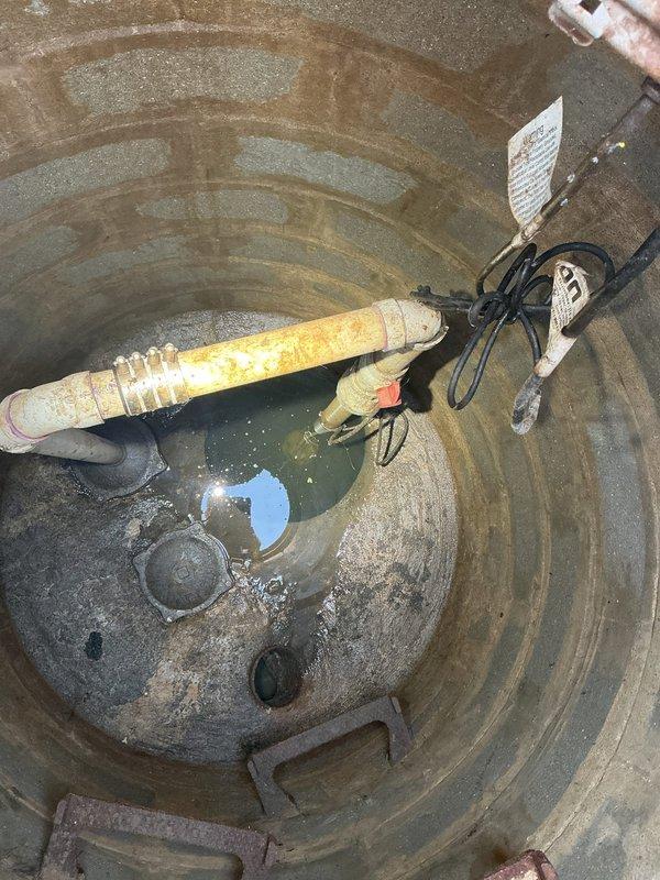 Responded to emergency basement flooding caused by failed sump pump. Upon arrival, found standing water in utility room with inoperative pump system. Removed failed pump unit from sump basin, which showed significant sediment accumulation and debris buildup. Cleaned sump pit interior, removing dirt and standing water. Installed new replacement sump pump with proper float switch configuration and electrical connections. Tested system operation to ensure proper activation and discharge through existing PVC drainage piping. Verified all connections were secure and system cycled correctly. Basement water level returned to normal with pump functioning as designed.