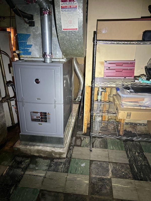 Responded to no hot water complaint and successfully installed replacement tanked water heater in basement utility area. Removed failed existing unit, installed new tank-style water heater with proper venting and connections, restored full hot water service to residence.