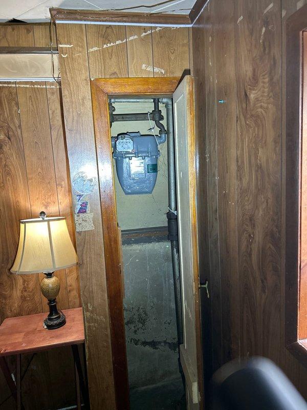 Responded to no hot water complaint and successfully installed replacement tanked water heater in basement utility area. Removed failed existing unit, installed new tank-style water heater with proper venting and connections, restored full hot water service to residence.