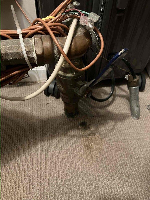 Conducted on-site evaluation for whole home water shut-off valve replacement. Documented existing valve assembly showing significant age-related deterioration, including visible oxidation and patina on brass components. Assessed current configuration of connected supply lines and fittings to determine scope of replacement work and provided photographic documentation for estimate preparation.