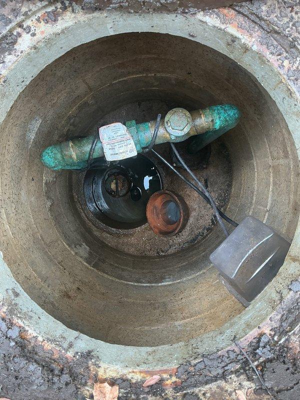 Performed comprehensive inspection and maintenance of exterior flood control system. Accessed underground utility vault, inspected water meter assembly and associated copper piping with visible oxidation and patina buildup. Completed cleaning and routing of flood control line to ensure proper drainage functionality and system operation.
