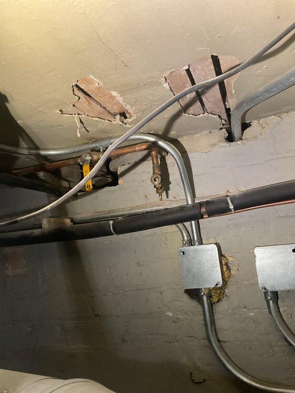 Completed solder repair on broken copper pipe leading to exterior hose bib, which was easily accessible from the garage. The repair was straightforward as all house piping had been previously replaced within recent years, ensuring compatibility with existing plumbing infrastructure.