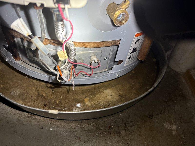 Conducted comprehensive inspection of residential water heater following customer reports of operational issues. Evaluated unit condition, plumbing connections, and overall system integrity. Documented existing installation showing age-related wear including corroded copper piping, oxidized fittings, and evidence of previous moisture accumulation in drain pan. Coordinated scheduling for flood control pump installation and acid neutralizer system work as requested by homeowner.