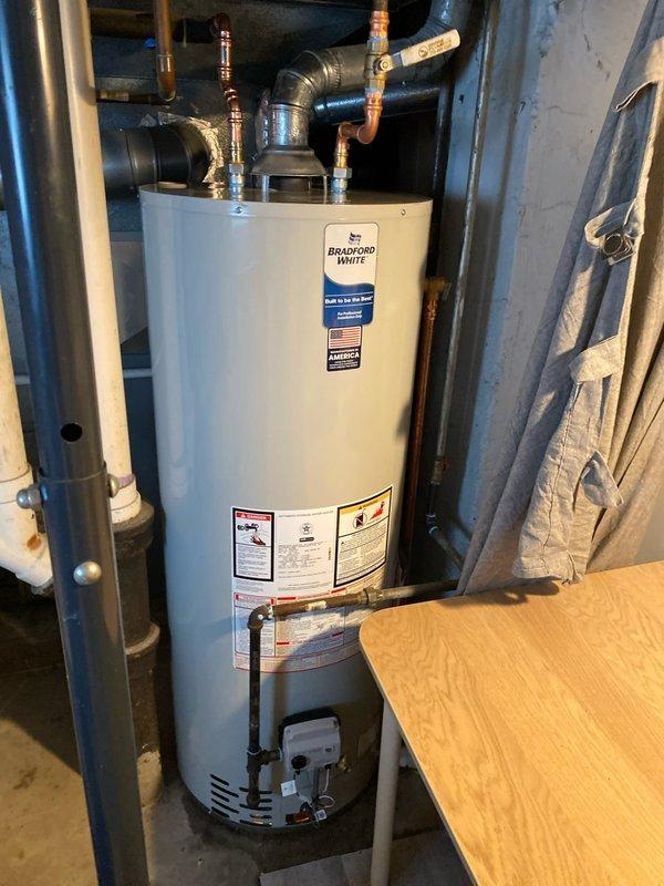 Responded to emergency no hot water call and performed same-day water heater replacement. Removed existing failed unit and installed new Bradford White residential water heater in crawlspace utility area. Connected all copper supply lines, installed brass shut-off valves on inlet and outlet connections, and integrated flexible water lines with proper fittings. Verified all plumbing connections for proper operation, tested unit functionality, and restored hot water service to the residence.