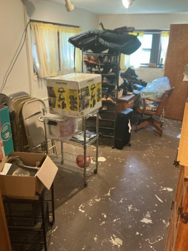 Responded to service call for catch basin drainage issues causing interior flooding during heavy rainfall events. Inspected outdoor catch basin and found standing sewer water indicating drainage obstruction. Documented interior water damage where groundwater had previously infiltrated through floor cracks during periods of excessive precipitation, requiring temporary pump usage by property owner to prevent backups into living space.