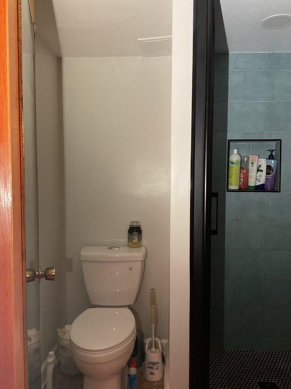 Conducted on-site assessment for sump pump installation in residential property currently without existing sump pump system. Evaluated basement bathroom area and adjacent spaces to determine optimal placement for sump basin and discharge routing. Documented existing conditions including plumbing fixtures, wall construction with wood paneling, and available floor space for equipment installation. Provided comprehensive estimate for complete sump pump system installation including basin excavation, pump unit, check valve, discharge piping, and electrical connections to protect property from potential water intrusion and flooding.