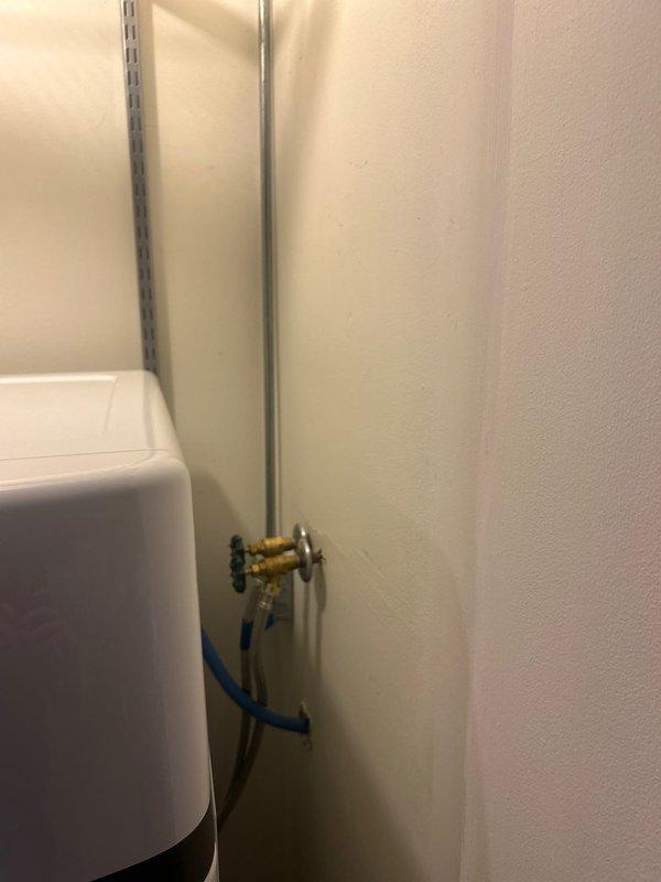 Relocated two water disconnect shutoffs in utility closet by repositioning them 4 inches higher to accommodate laundry room relocation. The existing shutoff valves were recently installed and in good condition, requiring only adjustment of their mounting position on the wall to meet the new plumbing configuration requirements for the condo unit.
