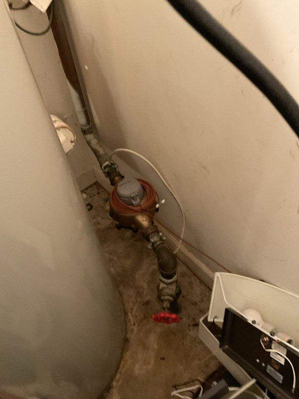 Responded to service call for toilet draining slowly despite customer's attempts to clear with plunger. Upon arrival, inspected toilet and bathroom plumbing system. Evaluated drainage performance and identified blockage in toilet trap. Utilized professional-grade closet auger to clear obstruction from toilet drain line. Removed blockage and restored proper drainage flow. Tested toilet multiple times to verify complete clearance and confirm water drains at normal rate. Inspected utility room plumbing connections and water supply lines to ensure no related issues. All fixtures operating properly upon completion. Documented site conditions with photographs for service records.