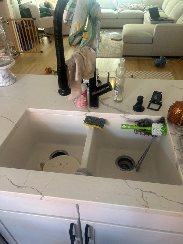 Responded to multiple plumbing concerns including a clogged shower drain with standing water, low water pressure throughout the residence, a malfunctioning first-floor toilet, and evaluation of the whole home water filtration system. Inspected the bathroom drainage system with linear floor drain and assessed water flow issues. Provided estimate for necessary repairs to restore proper drainage, water pressure, and toilet functionality.