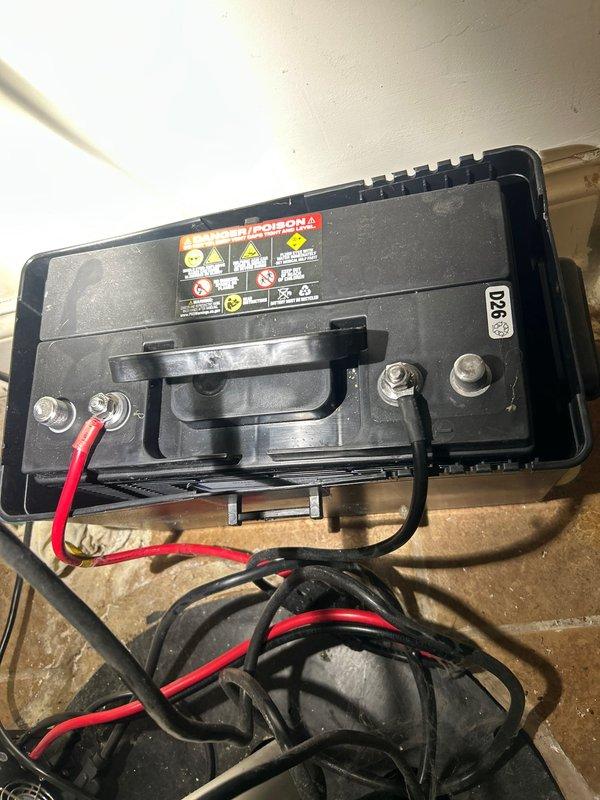 Replaced battery for 35 ACI backup sump pump system. Installed new battery unit, connected all terminal posts with proper polarity, and verified secure connections to ensure reliable operation of the emergency backup system.