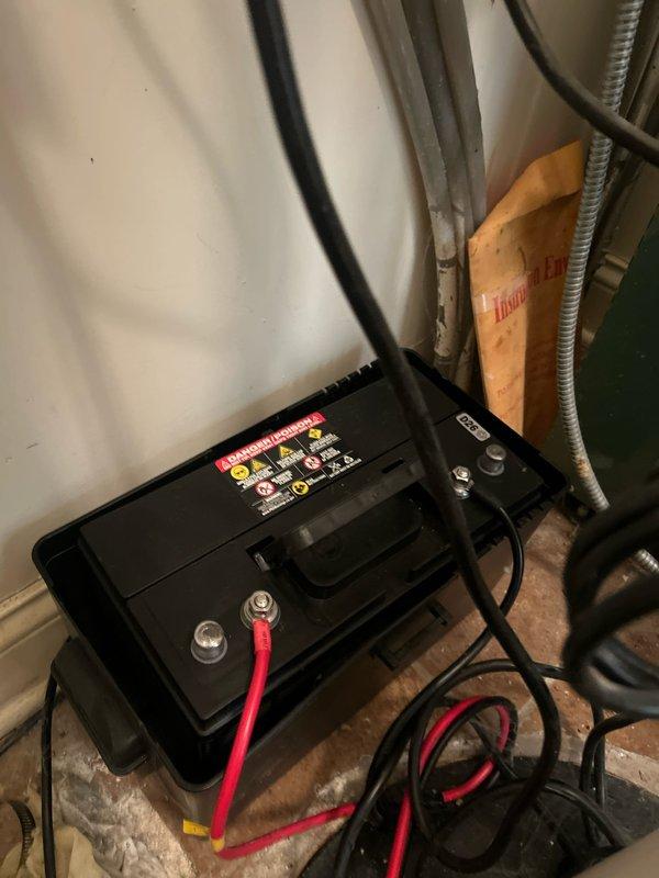 Replaced battery for 35 ACI backup sump pump system. Installed new battery unit, connected all terminal posts with proper polarity, and verified secure connections to ensure reliable operation of the emergency backup system.