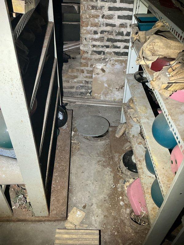 Responded to service call regarding elevated water consumption indicating potential pipe failure. Upon inspection of basement utility area, located and assessed plumbing infrastructure including water supply lines and associated fixtures. Examined exposed piping system with insulated black lines and turquoise-colored tubing, checking for visible leaks, moisture damage, and pressure irregularities. Inspected concrete floor surfaces and surrounding areas for water accumulation, staining patterns, and signs of active leakage that would account for increased water usage. Evaluated condition of pipe connections, valve assemblies, and mechanical joints throughout the accessible crawl space. Documented findings with photographic evidence showing basement plumbing configuration and overall condition of utility infrastructure for service records.