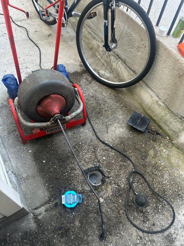 Responded to residential drain blockage using RIDGID mainline rod machine on 3" floor drain opening. Deployed mechanical cable auger to attempt clearage of obstruction in drain line. Service completed without televising inspection, rodding work performed with no warranty as specified.