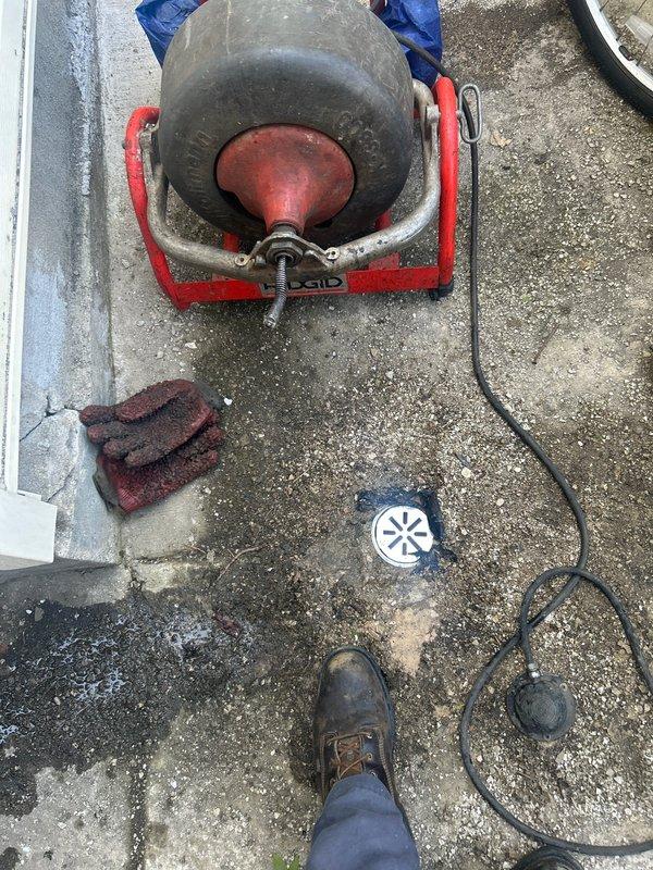 Responded to residential drain blockage using RIDGID mainline rod machine on 3" floor drain opening. Deployed mechanical cable auger to attempt clearage of obstruction in drain line. Service completed without televising inspection, rodding work performed with no warranty as specified.