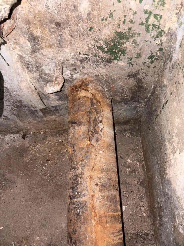 Responded to commercial facility for leaking 6-inch cast iron drain pipe in basement. Upon arrival, conducted thorough inspection of the deteriorated plumbing infrastructure. Found extensive corrosion and rust throughout the cast iron piping system, with active leak present at pipe joints. Wall surfaces showed significant moisture damage and deterioration from prolonged water exposure. Documented existing conditions through photographic evidence showing corroded cast iron vertical and horizontal pipe runs with failing threaded connections, adjacent galvanized piping, and compromised wall surfaces. Provided comprehensive estimate for cast iron pipe replacement and associated piping repairs to address the leak and prevent further water damage to the facility's basement structure.