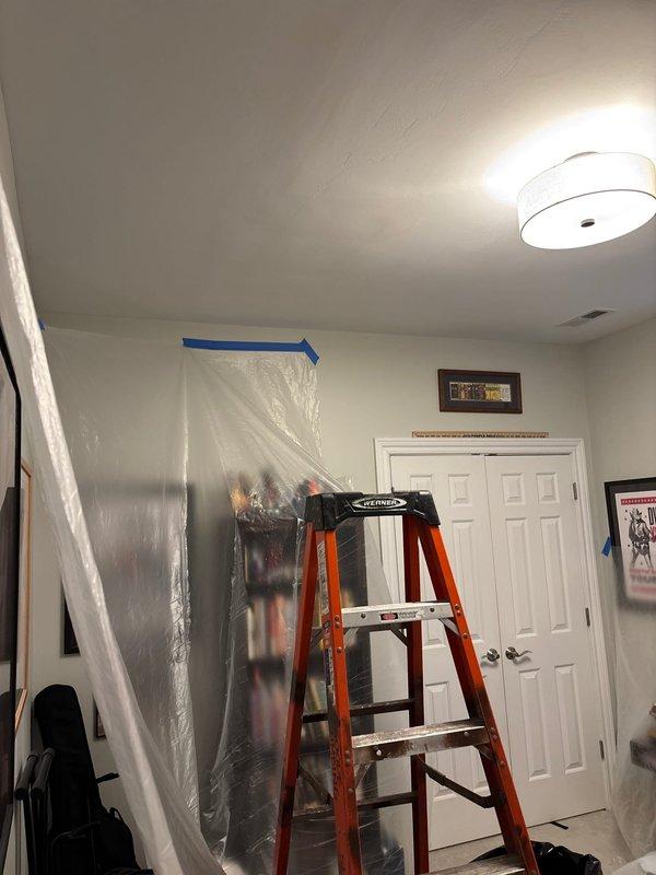 Responded to report of water damage on lower level bedroom ceiling located directly beneath upstairs bathroom. Conducted thorough inspection of plumbing system including crawl space access to examine PVC drain lines and P-trap configuration serving the bathroom fixture above. Documented existing plumbing infrastructure and identified potential leak source in drainage system. Protected work area with plastic sheeting and established containment protocol to prevent further water intrusion during assessment and repair process.