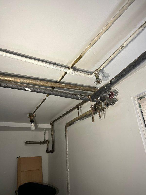 Responded to gas leak concern after utility company identified issue requiring professional pressure testing. Performed comprehensive pressure test on exposed gas piping system, including multiple gas lines and connections visible in mechanical area. Inspected all pipe joints, fittings, and valve assemblies throughout the gas distribution system to verify system integrity and locate source of reported leak.