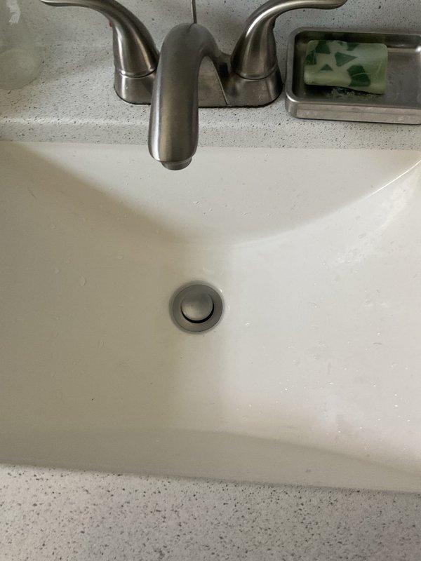 Responded to bathroom sink clog located beyond the P-trap in the drain line. Upon inspection, verified blockage was not accessible through standard P-trap removal and required snaking equipment to clear the obstruction. Successfully cleared the drain line using appropriate cable snake tools, restoring full drainage function to the bathroom sink fixture.