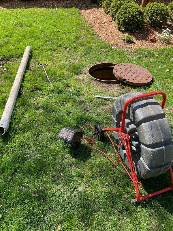 Performed routine sewer drain line camera inspection on 100-year-old residential property as part of annual maintenance plan coverage. Accessed main sewer line through exterior cleanout opening, deployed camera inspection equipment through accessible ground-level access point, and completed full video documentation of drain line condition. No blockages, root intrusion, or structural defects identified during inspection; system operating within normal parameters with no current issues requiring remediation.