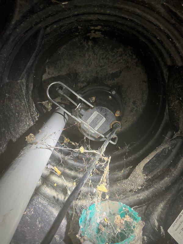 Responded to flooding concern and conducted thorough inspection of drainage system. Investigated sump pump pit and found deteriorated float mechanism with visible corrosion and debris accumulation affecting proper operation. Inspected crawl space beneath structure and verified adequate drainage stone coverage and structural integrity of floor joists, confirming no standing water or moisture damage present. Provided recommendations for sump pump replacement and preventative maintenance measures to avoid future flooding incidents.