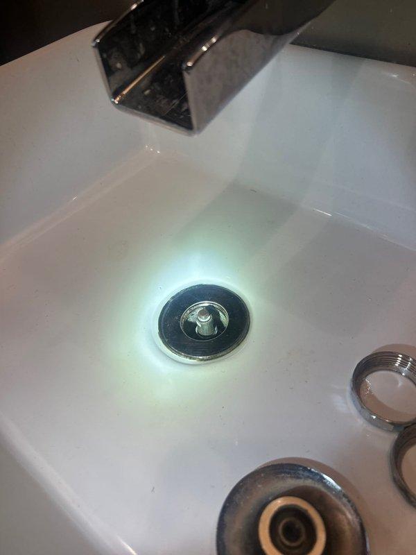 Responded to priority call for bathroom sink leaking underneath due to broken pipe. Upon inspection, identified failed connection at the P-trap assembly beneath the vanity sink. Removed damaged piping section and replaced with new PVC drain components, ensuring proper alignment and secure connections at the tailpiece and trap arm. Tested all connections for leaks and verified proper drainage operation before completing the repair.