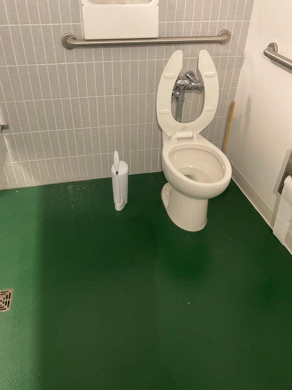 Responded to a drain backup issue affecting two bathrooms where water was coming up through floor drains. Inspected the accessible bathroom with floor drain and under-sink plumbing in the kitchen area. Identified blockage in the main drain line causing wastewater to reverse flow through floor drains in both bathroom locations. Cleared the obstruction using professional drain cleaning equipment, restoring proper drainage flow throughout the system. Tested all affected drains to confirm complete clearance and verified no further backup issues.