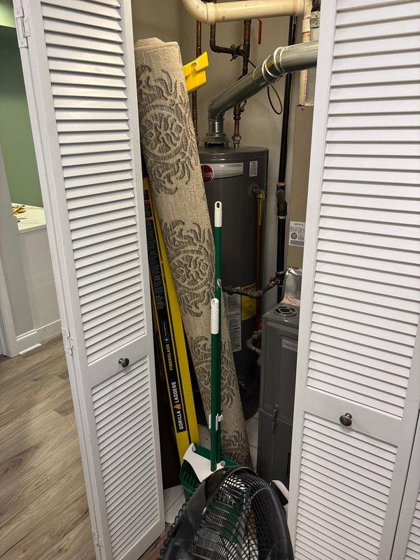 Responded to service call for water hammer noise occurring when washing machine drains and performed assessment of ejector pump system requiring replacement. Evaluated utility closet installation including pump basin, discharge piping, and associated plumbing connections. Documented existing system configuration with measurements of discharge pipe height and clearances for proper replacement specifications. Additionally inspected Kohler electronic bidet toilet in master bathroom to assess operational status and functionality of remote control features.