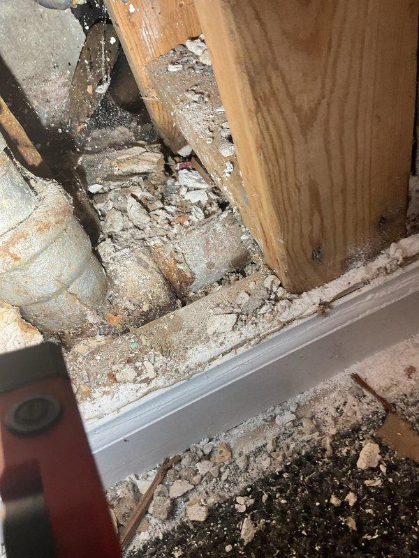Completed level 1 diagnostic on utility sink drain system that developed a leak following rodding service by another contractor. Assessment revealed water damage to wooden framing and surrounding structure at base of sink cabinet, with significant deterioration of drywall and building materials evident. Provided customer with repair quote and water heater replacement options for future consideration.