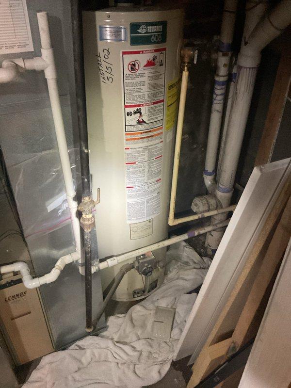 Responded to no hot water complaint and performed diagnostic evaluation of existing Reliance 606 gas water heater (40-gallon capacity). Confirmed unit failure and provided estimate for replacement options, including like-for-like 40-gallon gas water heater installation and alternative tankless water heater system. Documented existing installation configuration, including copper supply lines, gas connections, venting system, and current placement in basement utility area. Reviewed specifications and discussed equipment options to meet household hot water demands.