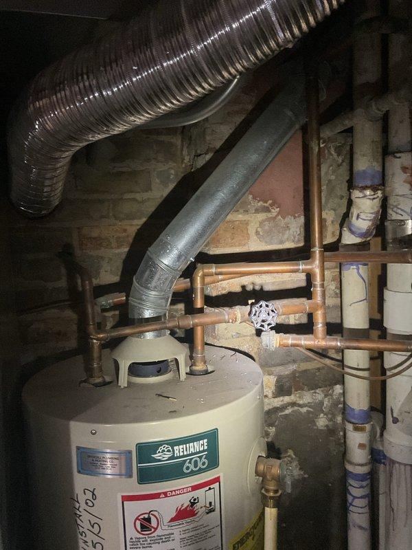 Responded to no hot water complaint and performed diagnostic evaluation of existing Reliance 606 gas water heater (40-gallon capacity). Confirmed unit failure and provided estimate for replacement options, including like-for-like 40-gallon gas water heater installation and alternative tankless water heater system. Documented existing installation configuration, including copper supply lines, gas connections, venting system, and current placement in basement utility area. Reviewed specifications and discussed equipment options to meet household hot water demands.
