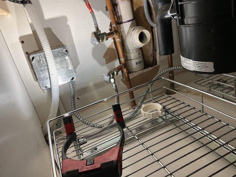 Responded to kitchen sink backup with complete drainage failure. Upon arrival, confirmed no visible blockages in disposal or p-trap as previously checked. Deployed professional drain cleaning equipment with power auger to access main drain line beneath sink cabinet. Successfully cleared significant blockage in drain line that had been causing progressive slow drainage over previous 1-2 months before complete stoppage occurred. Ran water to verify full drainage restoration and proper flow rate. System tested and functioning normally upon completion.