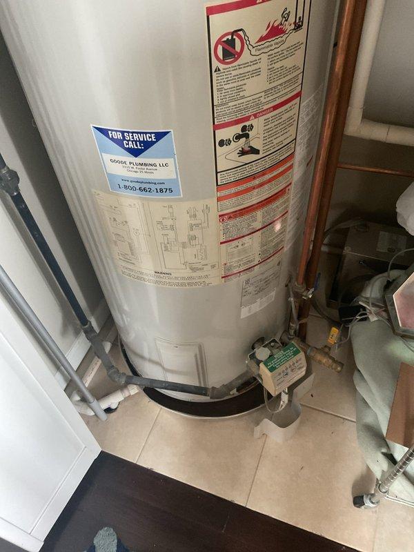 Responded to service call for leaking water heater. Upon inspection, identified an AO Smith VERTEX water heater with active leak from piping connection. Evaluated unit condition, plumbing connections, and surrounding installation components including copper supply lines, drip pan, and associated water treatment system to provide comprehensive estimate for repair or replacement options.