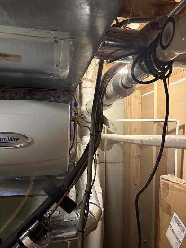 Removed existing 50-gallon conventional storage tank water heater from utility room and successfully installed new tankless water heating system. Installation included proper venting configuration, gas line connections, water supply line modifications, and electrical wiring to meet manufacturer specifications and local code requirements.