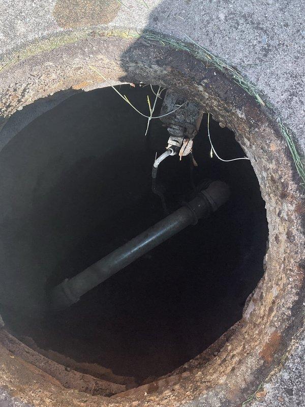 Responded to customer request for plumbing inspection regarding pipe replacement at residential property. Conducted thorough visual assessment of exterior water supply system, including hose bib mounted on brick foundation wall and underground utility access point. Documented existing piping conditions through photographic evidence, noting black pipe routing through below-grade access pit with visible cable tie securing methods. Inspection revealed aging infrastructure with weathered concrete surfaces and potential access points for future pipe replacement work.