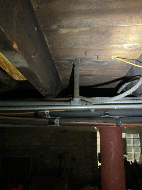 Responded to gas service call for property with no gas supply. Conducted comprehensive pressure test of gas distribution system throughout multi-level building. Identified multiple gas leaks at various locations across different floors, including compromised connections in crawl space area where gas piping runs beneath structure along floor joists. Documented all leak locations with photographs showing affected piping systems, including flexible gas connectors and copper supply lines secured to structural members. Advised property owner that extensive repairs to gas distribution system are required before service can be safely restored. Gas supply remains shut off pending completion of necessary repairs to eliminate all identified leaks and ensure system integrity.