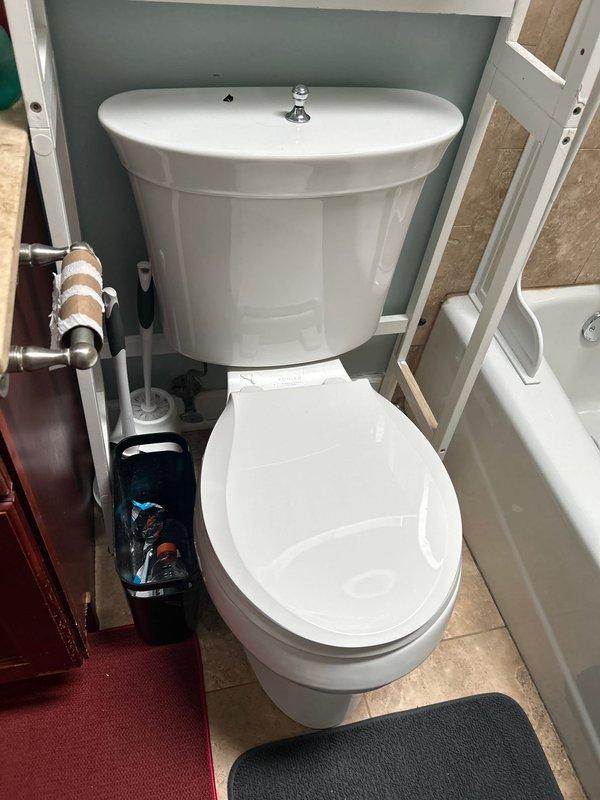 Responded to priority service call for multiple plumbing issues including two showers with leaking hand sprayers, a third shower with mixing valve leak upon activation, and loud noise occurring during toilet flushing. Inspected chrome-plated shower fixtures and identified leak points at hand sprayer connections and mixing valve assembly. Examined toilet installations and plumbing system to diagnose source of water hammer noise during flush cycles. Documented conditions of bathroom fixtures including toilet, vanity plumbing connections with copper supply lines, and shower components for assessment. Provided estimates for replacement of four toilets as requested by customer.