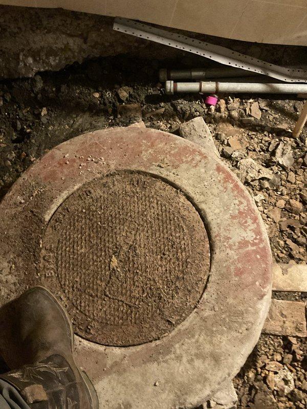 Responded to main drain backup causing kitchen water to flood basement and fill sump pit. Accessed main cleanout in crawl space and ran power auger through main sewer line to street to clear blockage caused by accumulated debris and buildup. Line was successfully cleared and tested with water flow to confirm proper drainage. Advised customer that recurring backups indicate deteriorating pipe condition and recommended camera inspection to assess line integrity and determine if section replacement is needed to prevent future failures.