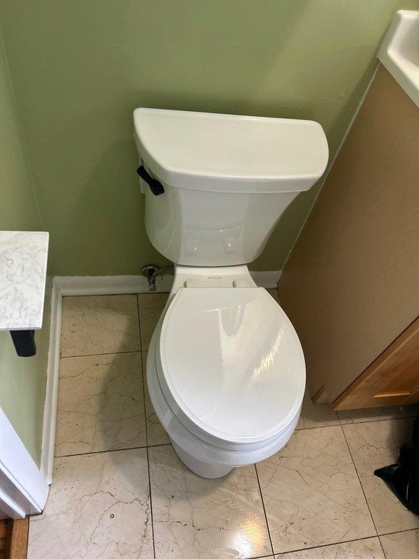 Completed building water shutdown to facilitate plumbing repairs in bathroom facility. Addressed deteriorated floor drain with compromised grout and surrounding tile damage, replaced corroded drain components and resealed perimeter to prevent water infiltration. Serviced toilet supply line connections and shut-off valve to ensure proper operation following building water restoration.