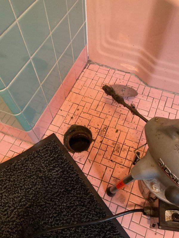 Responded to service call for clogged bathtub drain. Upon arrival, assessed the bathroom plumbing system and identified blockage in the tub drain line. Utilized professional drain cleaning equipment and hand tools to clear the obstruction, restoring proper drainage function. Verified water flow and confirmed the drain was operating correctly before completing the service.