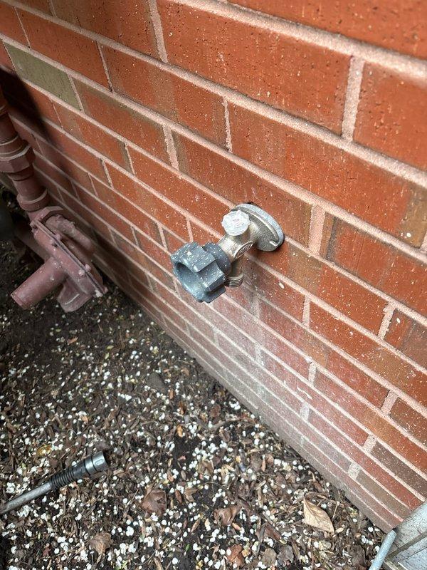 Installed new outdoor spigot assembly featuring a PRIER quarter-turn frost-free valve with copper supply line connection. Mounted the fixture to exterior brick wall using secure metal brackets and hardware, ensuring proper drainage and freeze protection for year-round operation.