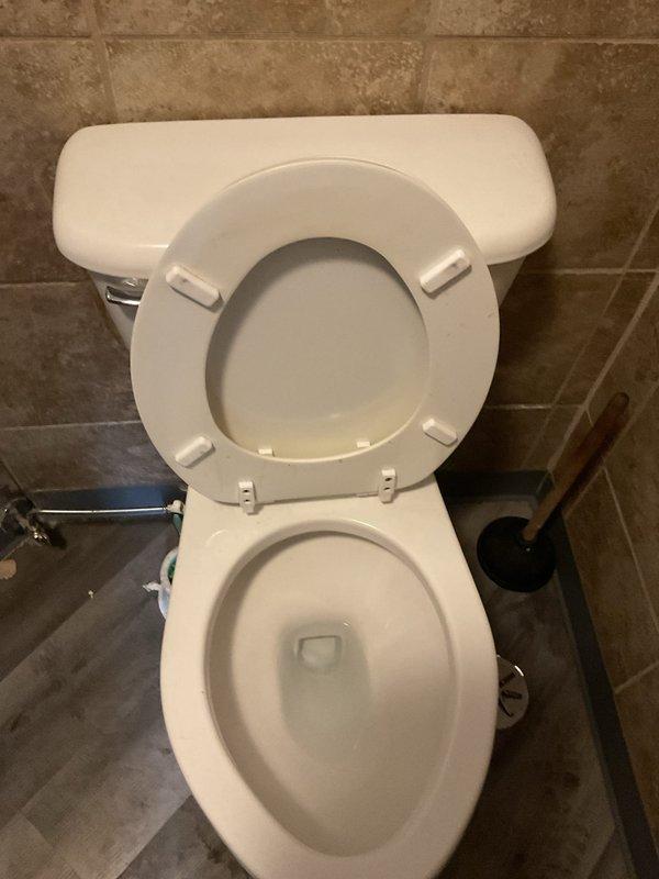Responded to commercial facility for clogged toilet obstruction. Upon arrival, assessed the fixture and deployed plumbing snake with appropriate tooling to clear the blockage in the drain line. Successfully removed obstruction and restored proper drainage and flushing function to the toilet. Documentation photos captured before and after completion of work.