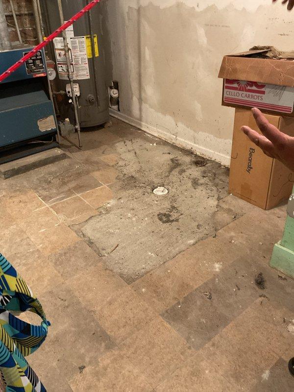 Responded to basement bathroom sewage backup affecting tub and sink. Upon inspection, identified missing sections of drainage pipe and improper plumbing installation with disconnected sewer line connections. Documented existing conditions including incomplete pipe assembly and potential need for water damage remediation following previous rodding service by another contractor.