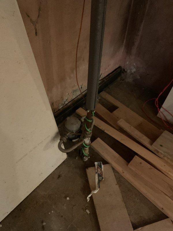 Responded to basement bathroom sewage backup affecting tub and sink. Upon inspection, identified missing sections of drainage pipe and improper plumbing installation with disconnected sewer line connections. Documented existing conditions including incomplete pipe assembly and potential need for water damage remediation following previous rodding service by another contractor.