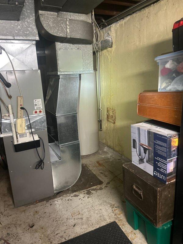 Responded to service call for tankless water heater consultation and estimate. Upon arrival, inspected existing conventional tank-style water heater in basement utility area. Unit showed signs of age with surrounding wall discoloration indicating potential previous moisture issues. Assessed current plumbing configuration, available gas line capacity, electrical requirements, and venting pathways necessary for tankless conversion. Discussed advantages of tankless systems including energy efficiency, continuous hot water supply, and space savings versus traditional tank models. Evaluated basement layout and clearance requirements for proper tankless unit installation. Documented existing conditions through photography and provided professional recommendations for appropriate tankless water heater sizing based on household hot water demands. Prepared comprehensive estimate for complete removal of existing tank water heater and installation of new tankless system including necessary gas li