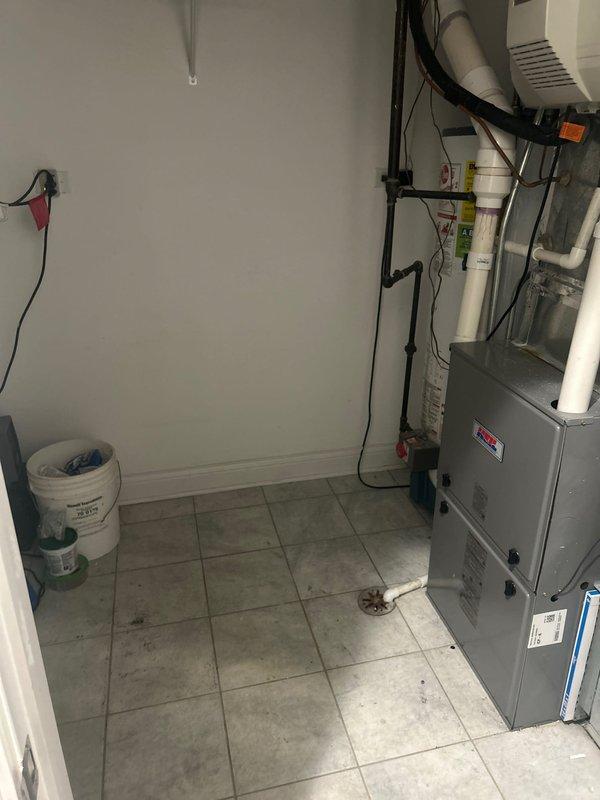 Responded to service call for leaking 50-gallon residential water heater in utility room. Upon inspection, confirmed active leak from tank while unit still producing hot water. Provided estimate for complete water heater replacement with new 50-gallon tank unit, including removal and disposal of existing failed water heater, installation of new unit with proper plumbing connections, and compliance with current code requirements.