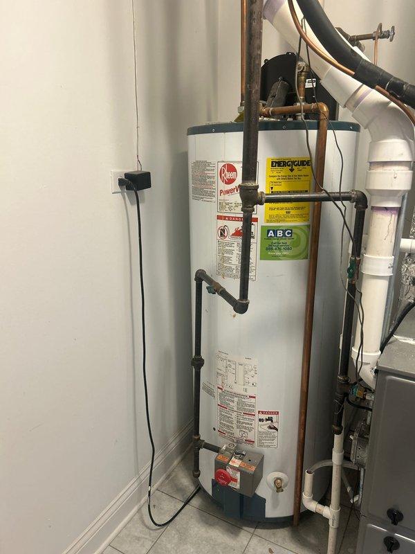 Responded to service call for leaking 50-gallon residential water heater in utility room. Upon inspection, confirmed active leak from tank while unit still producing hot water. Provided estimate for complete water heater replacement with new 50-gallon tank unit, including removal and disposal of existing failed water heater, installation of new unit with proper plumbing connections, and compliance with current code requirements.